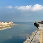 Isolotto di sabbia e detriti alla foce del fiume Misa